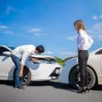 Two Drivers arguing after a car accident on the road